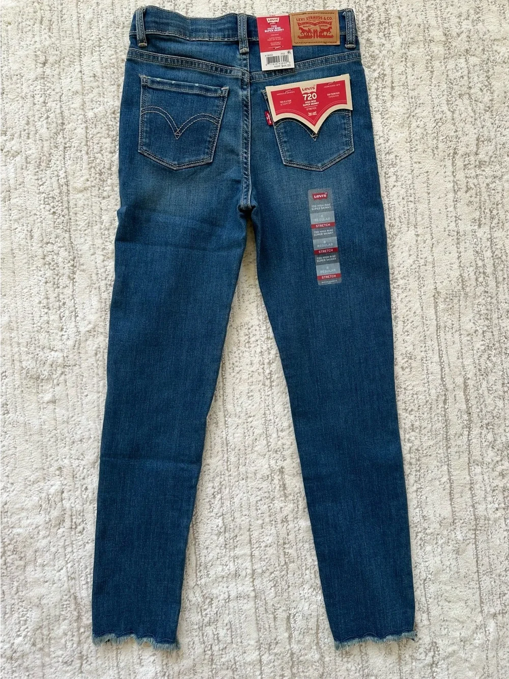 Levis 720 High Rise Super Skinny Jeans Girls 8 Blue Distressed Raw Hem